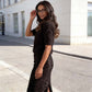Elegante top con dettaglio a fiocco e gonna con paillettes