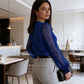Top con scollo a V e maniche trasparenti con paillettes