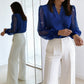 Top con scollo a V e maniche trasparenti con paillettes