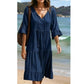 Abito midi da donna con scollo a V, nappine e gonna a balze
