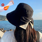 Cappello da donna con fiocco e tesa larga per proteggersi dal sole