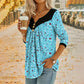 T-shirt da donna a maniche lunghe con scollo a V e stampa.