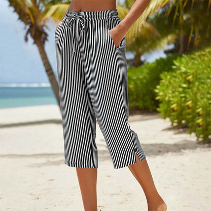 Pantaloni a zampa a righe in cotone e lino da donna con tasche