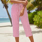 Pantaloni a zampa a righe in cotone e lino da donna con tasche