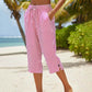 Pantaloni a zampa a righe in cotone e lino da donna con tasche
