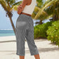 Pantaloni a zampa a righe in cotone e lino da donna con tasche
