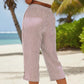Pantaloni a zampa a righe in cotone e lino da donna con tasche